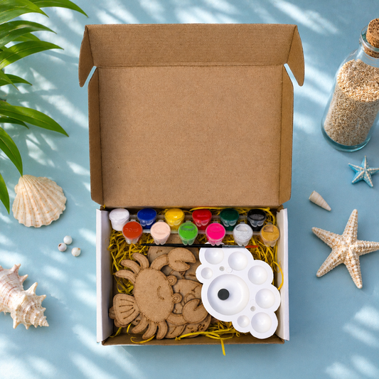 Top View of DIY Ocean Odyssey Fridge Magnet Kit showing all 8 MDF Sea Creature Cutouts Paints Brush and Palette